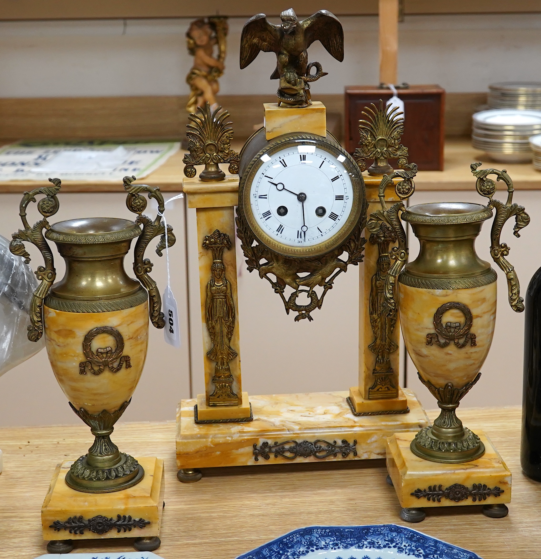 A 19th century French Sienna marble and gilt bronze clock garniture, with eagle surmount to clock, 48cm high. Condition - good